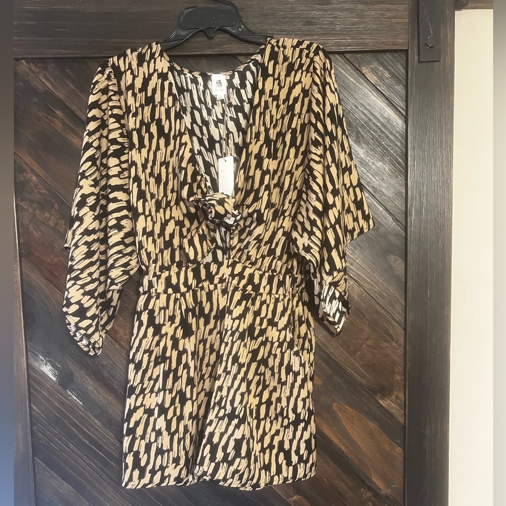 Vice Romper Size Small NWT. Has a tie front and triangle cut out